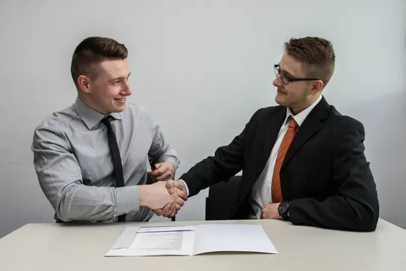 Two partners discussing a contract